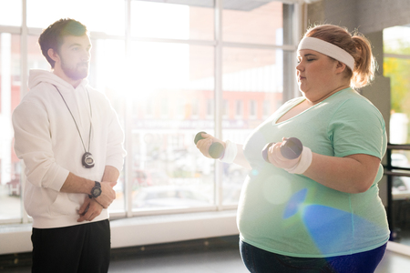 Obese Woman Working Out in Sunlightの写真素材