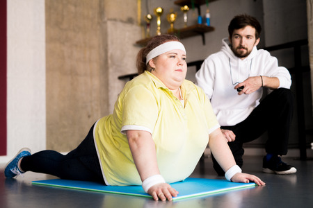 Obese Young Woman Doing Sportsの写真素材
