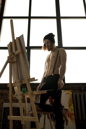 Contemporary Artist Looking at Paintingの写真素材