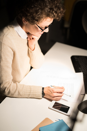 Young Woman Working at Nightの写真素材