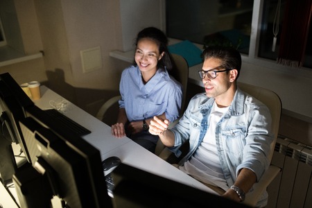 Colleagues Working at Nightの写真素材