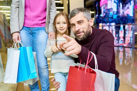 Little Girl Shopping with Dadの写真素材