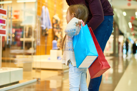Cute Girl Shopping with Momの写真素材