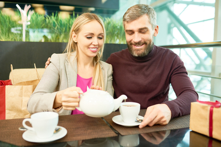 Couple Drinking Tea in Cafeの写真素材
