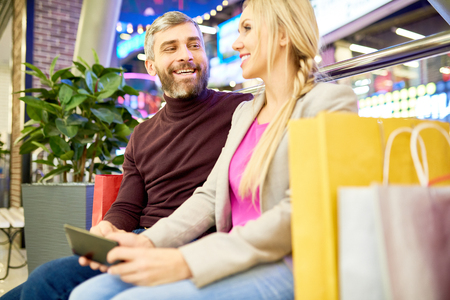 Smiling Couple in Shopping Mallの写真素材