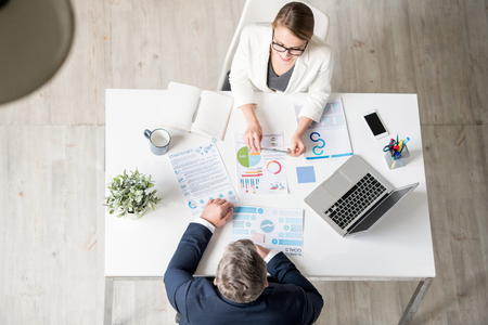 Analytical expert explaining statistics to businessmanの写真素材
