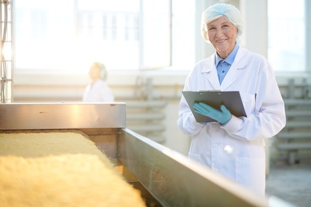Senior Factory Worker in Sunlightの写真素材