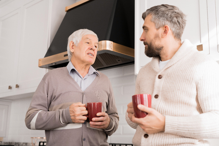 Senior Father Talking to Adult Sonの写真素材