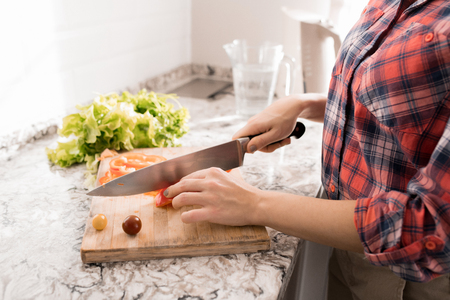 Woman Cutting Saladの写真素材