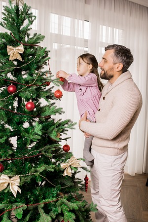 Father and Child Preparing for Christmasの写真素材