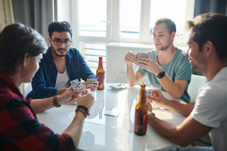 Friends playing cardsの写真素材
