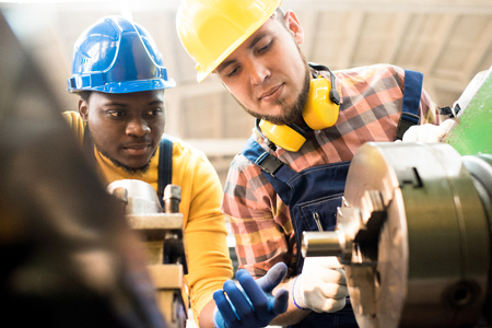 Lathe Operators Adjusting Machineの写真素材