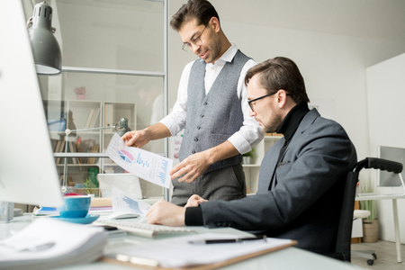 Businessmen discussing business plan togetherの写真素材