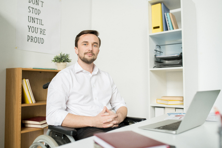 Confident disabled manager at officeの写真素材