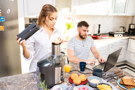 Modern Young Couple in Kitchenの写真素材