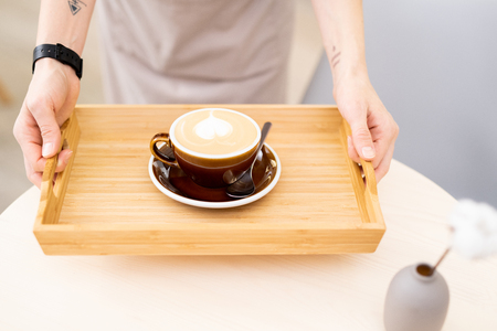 Morning coffee on wooden trayの写真素材