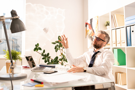 Pensive upset businessman without creative ideasの写真素材