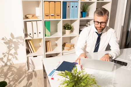 Concentrated business analyst preparing reportの写真素材