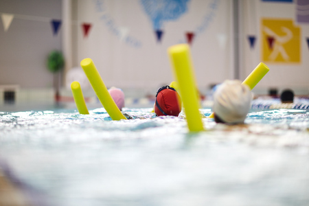 Children learning to swim