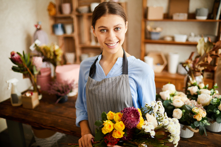 Beautiful Woman Posing in Flower Shopの写真素材