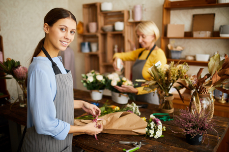 Joyful Florist Making Bouquetsの写真素材