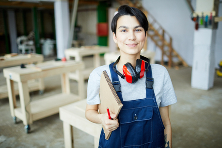 Pretty girl learning about carpentryの写真素材