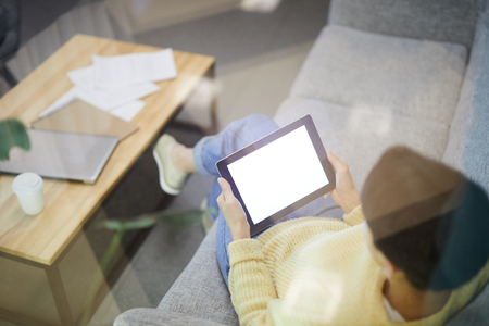 Modern woman watching video on tabletの写真素材