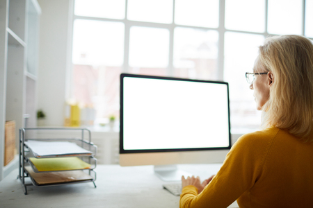 Businesswoman Looking at Blank Screenの写真素材