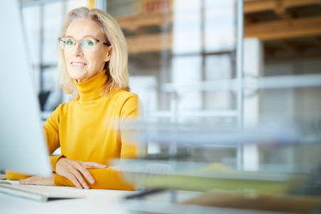 Mature Businesswoman in Officeの写真素材