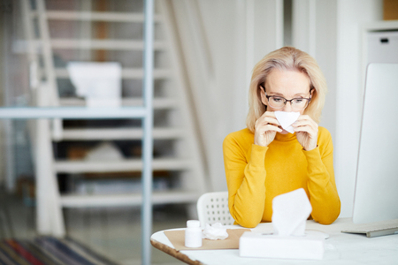 Sick Businesswoman at Workの写真素材