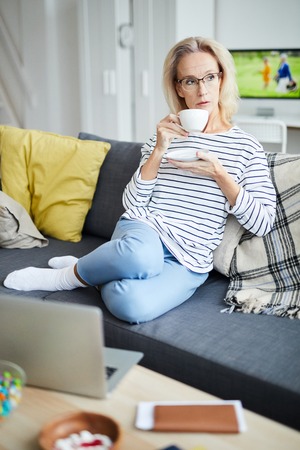 Woman Enjoying Home Comfortの写真素材
