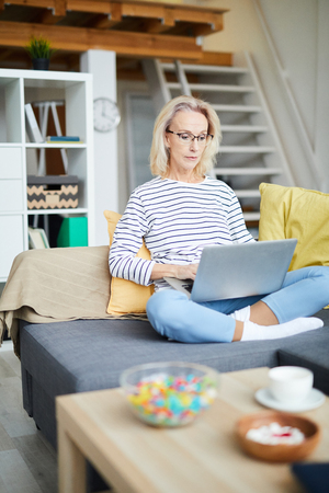 Contemporary Adult Woman Working at Homeの写真素材