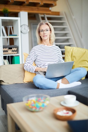 Mature Woman Writing Blogの写真素材