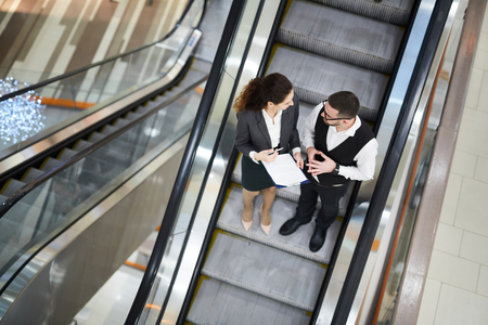 Meeting on escalatorの写真素材