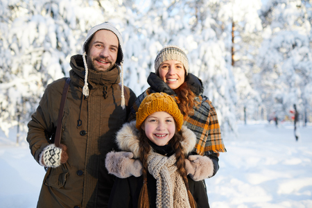 Happy Family in Winter Parkの写真素材