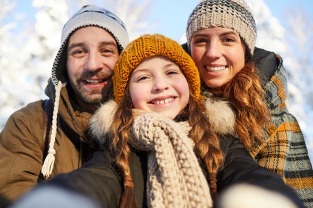 Family Taking Selfie in Winterの写真素材