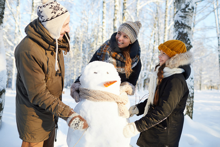Family Building Snowmanの写真素材