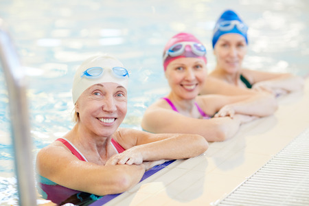 Three Mature Women Posing in Poolの写真素材