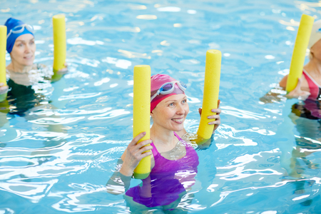 Adult Women Working Out in Waterの写真素材