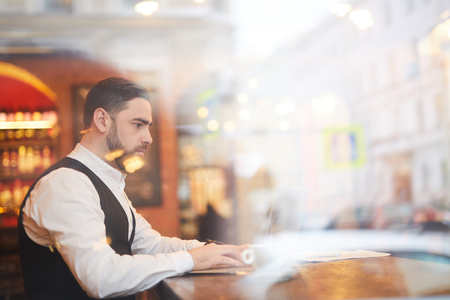 Handsome Businessman Working on Coffee Breakの写真素材