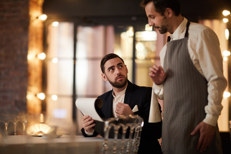 Man Ordering Food in Restaurantの写真素材
