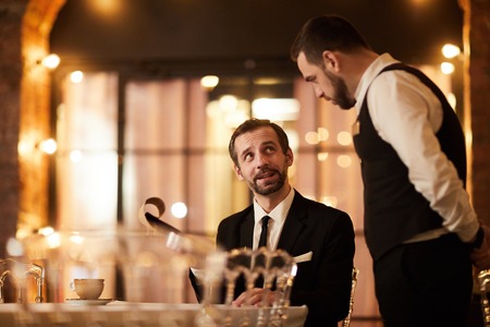 Client Ordering Food in Restaurantの写真素材