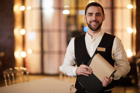 Profesional Waiter in Restaurantの写真素材