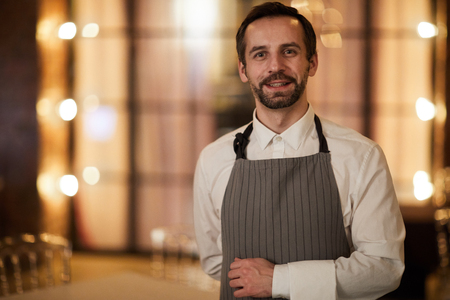 Mature Waiter in Restaurantの写真素材