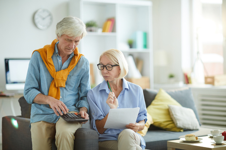 Adult Couple Calculating Budgetの写真素材