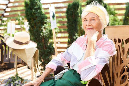 Senior Woman Resting in Gardenの写真素材