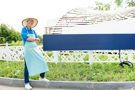 Senior Gardener Posing by Plantationの写真素材