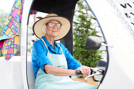 Senior Gardener Driving Carの写真素材
