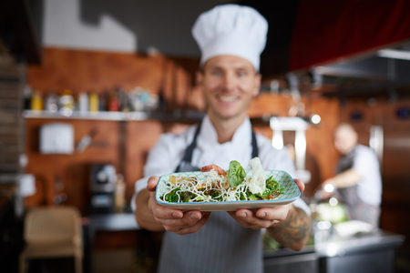 Chef Presenting Dishの写真素材