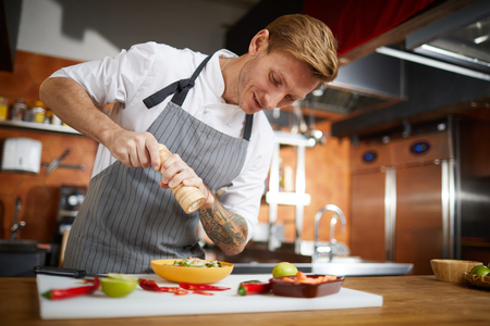Professional Chef Seasoning Dishの写真素材